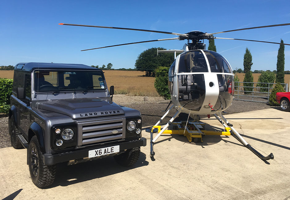 Photo of helicopter, jeep, and helicopter tug