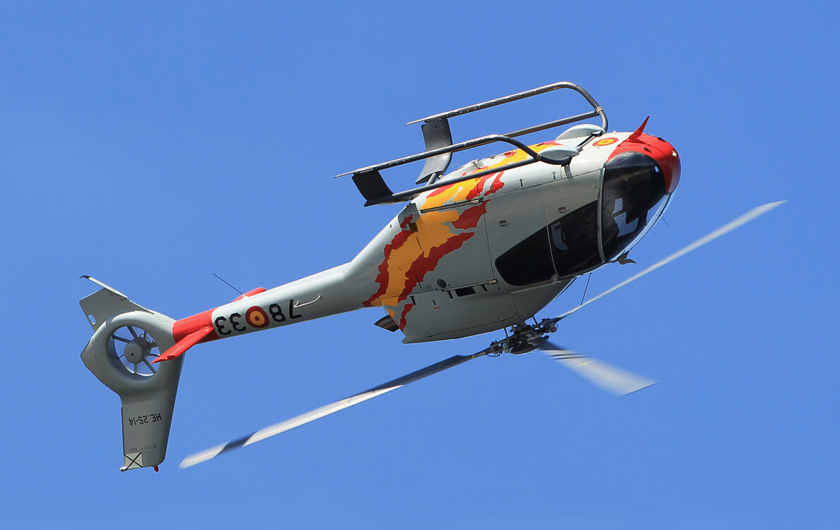 A Spanish Air Force Eurocopter EC120 (now Airbus H120) Colibri performing a barrel roll maneuver.